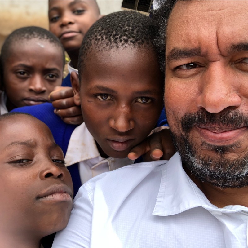 Marvin with children in Africa